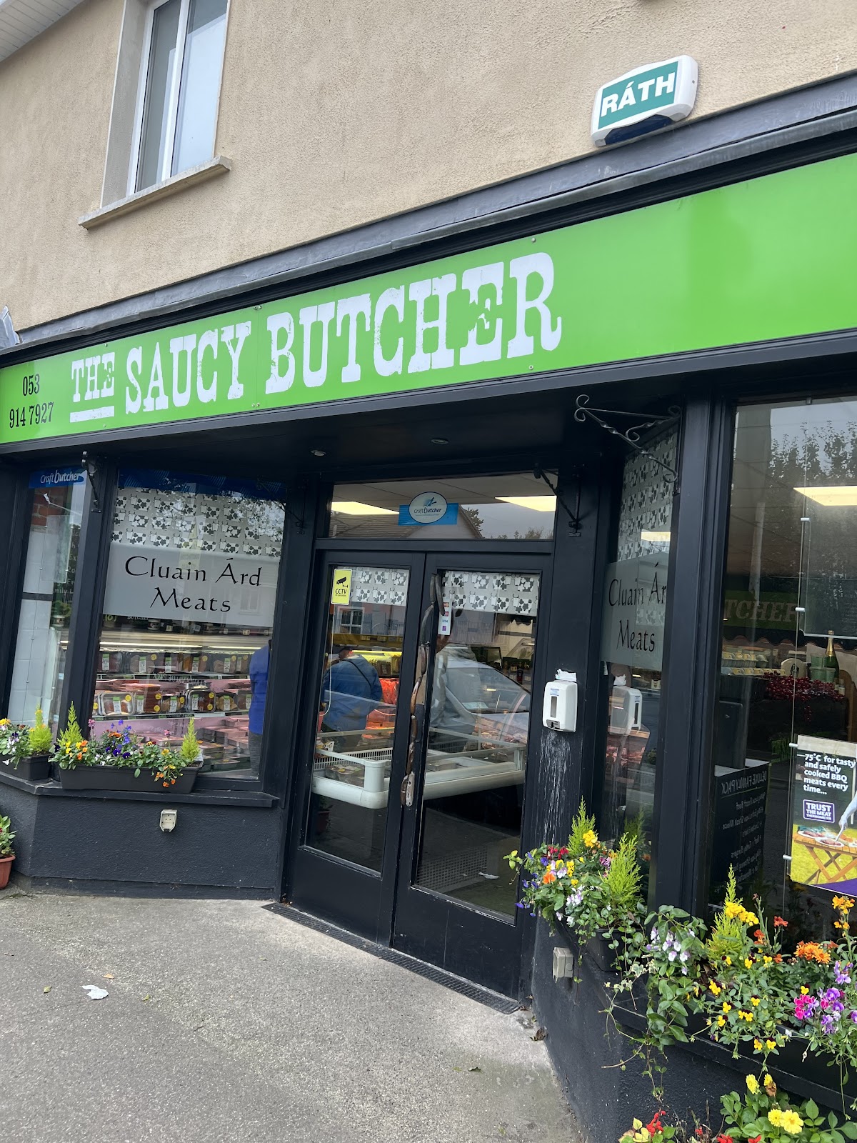 The Saucy Butcher shopfront on Clonard Road, Wexford, with the lime-green fascia and Cluain Árd Meats on the windows